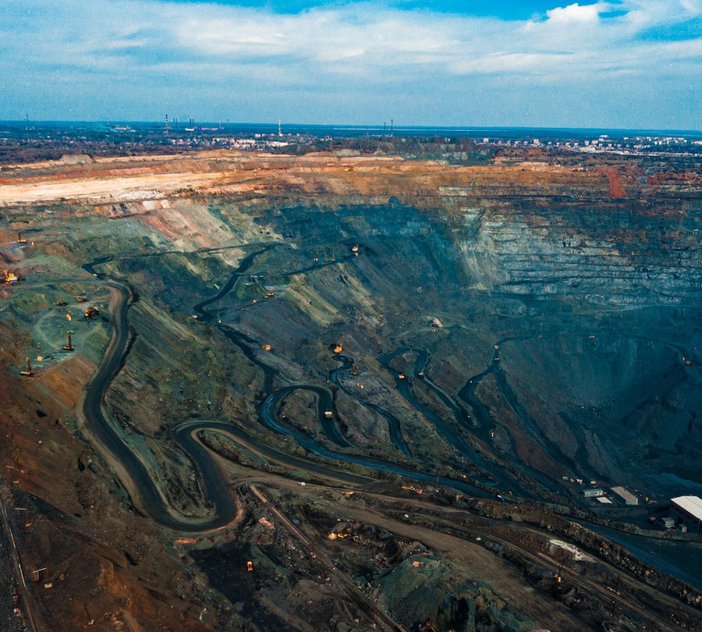 Aerial view of the Iron ore mining, Panorama of an open-cast mine extracting iron ore, preparing for blasting in a quarry mining iron ore, Explosive works on open pit